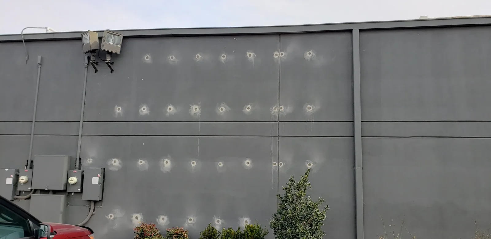 Commercial gutter installation on a gray block wall