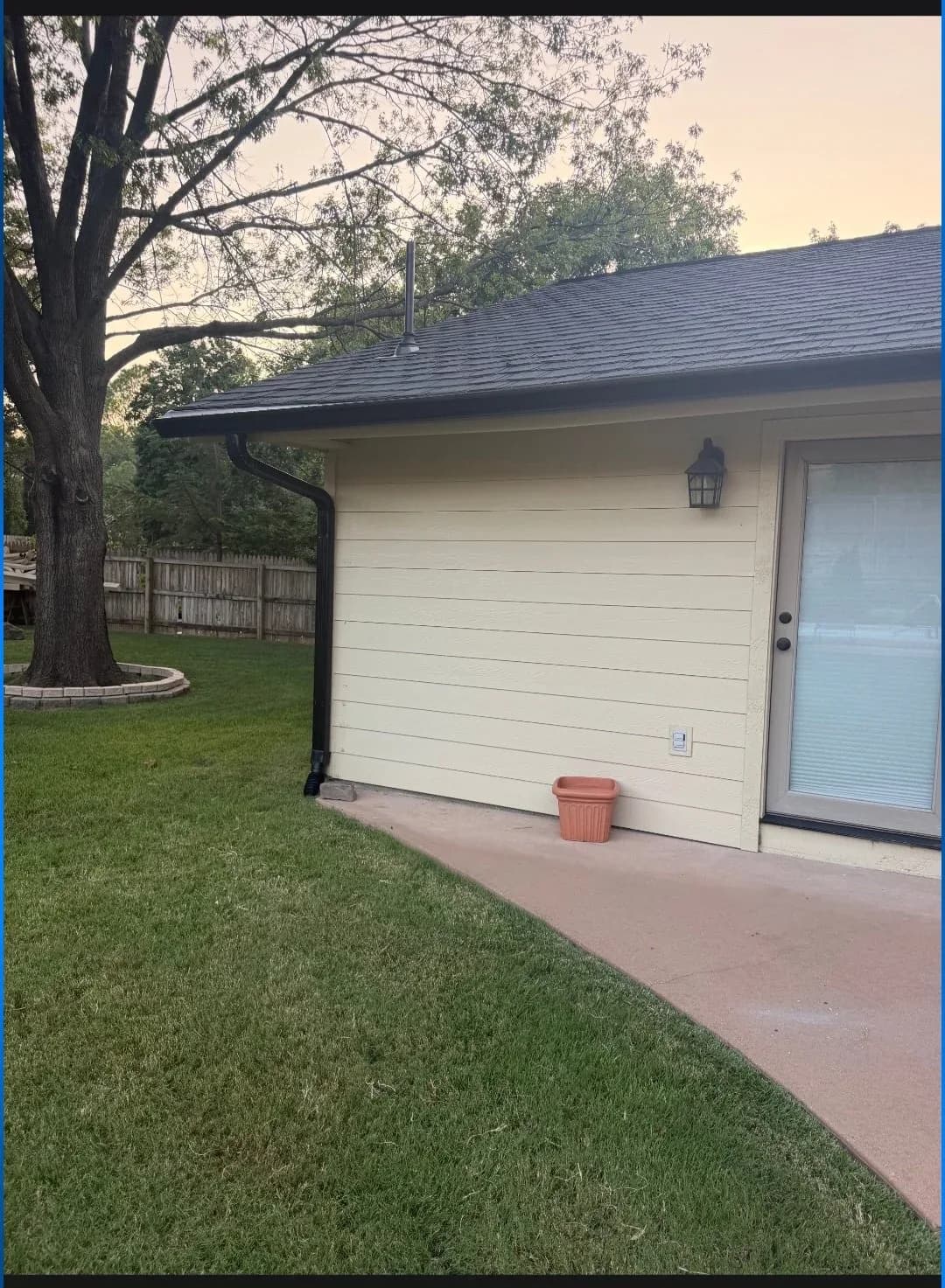 Seamless gutter run along a garage