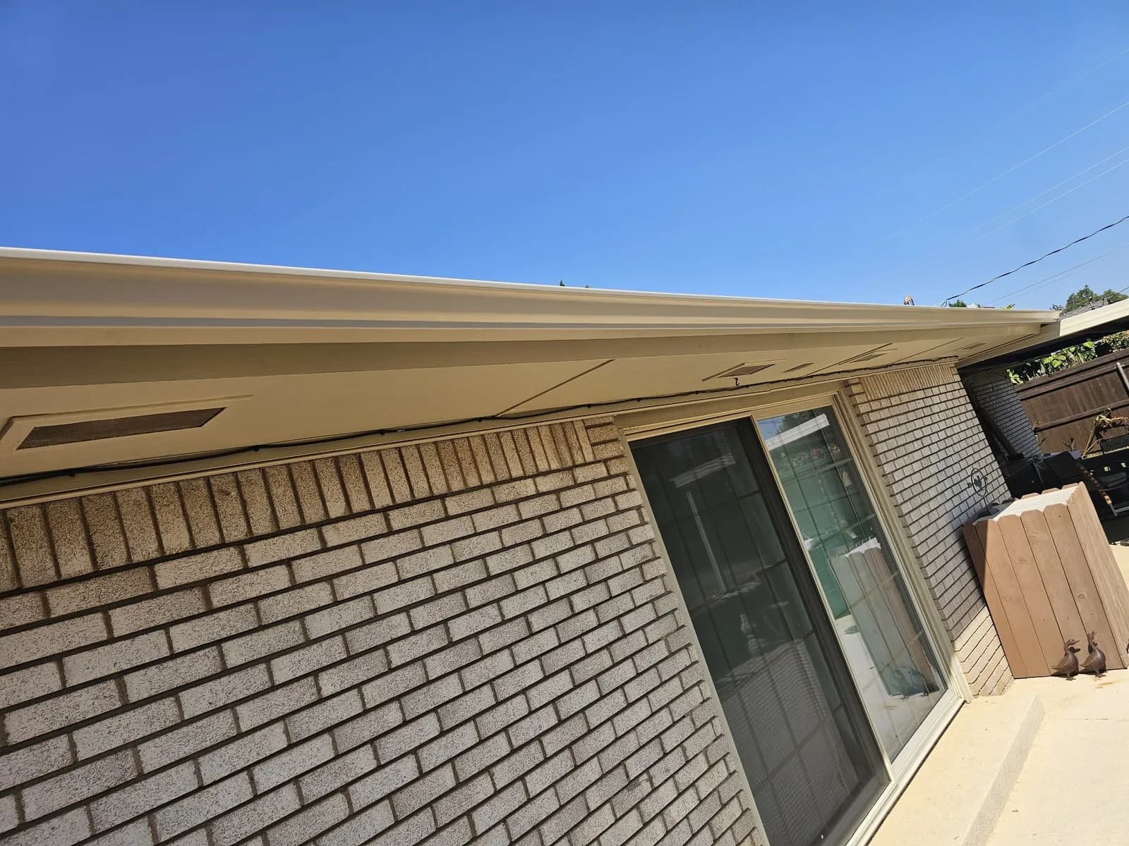 Long gutter run over a back patio