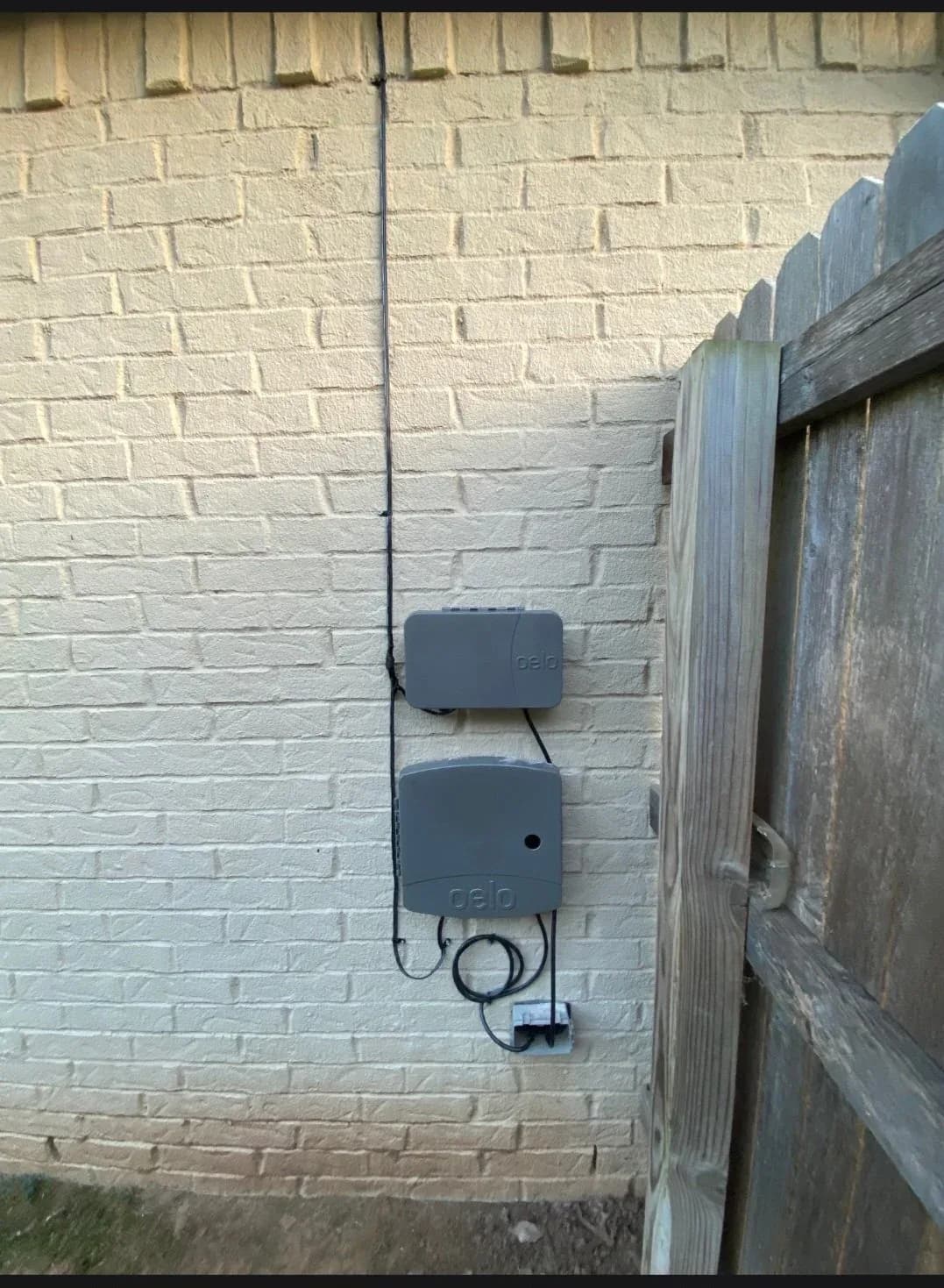 Lighting controller mounted beside the gate