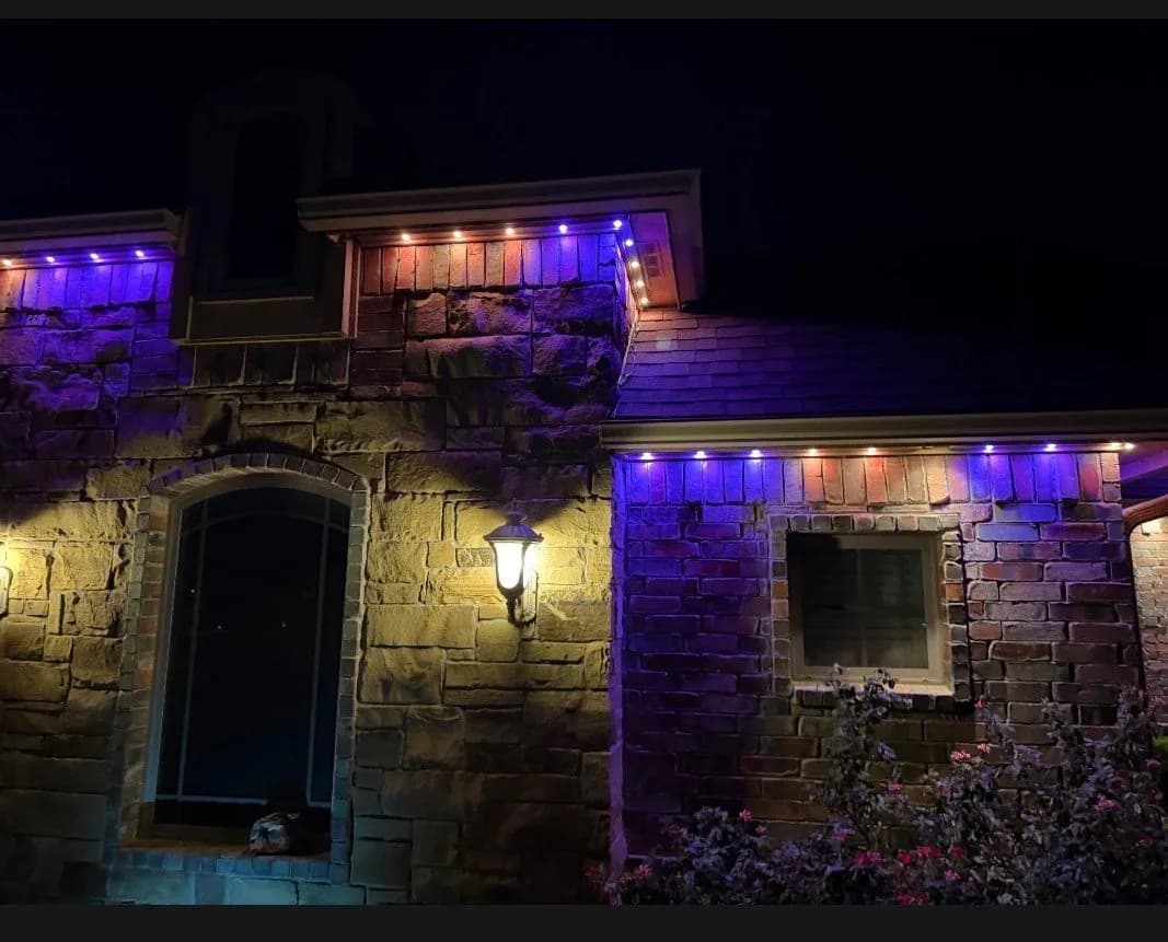 Stone facade with purple and blue roofline lights