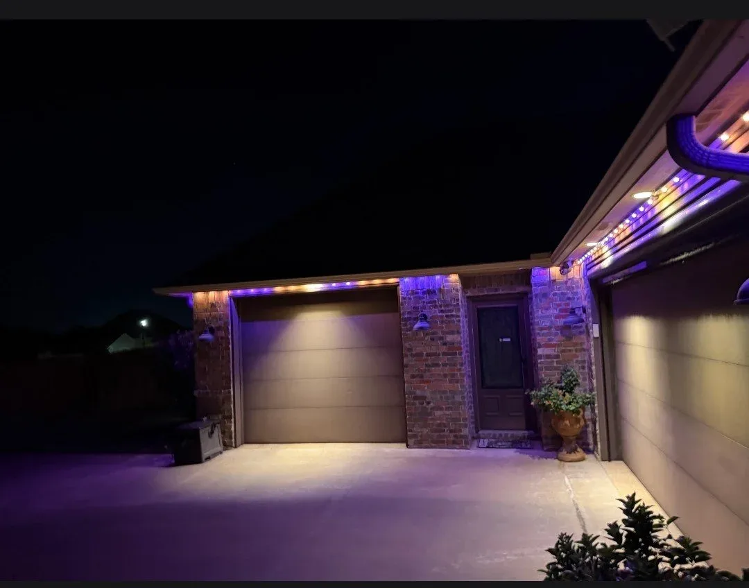 Garage and entry lit purple at dusk